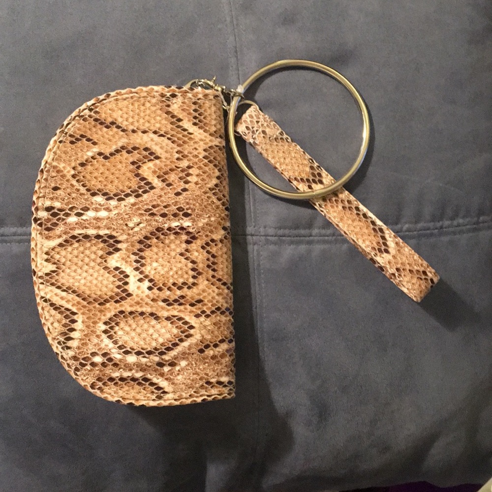 Reptile/snakeskin print wristlet.